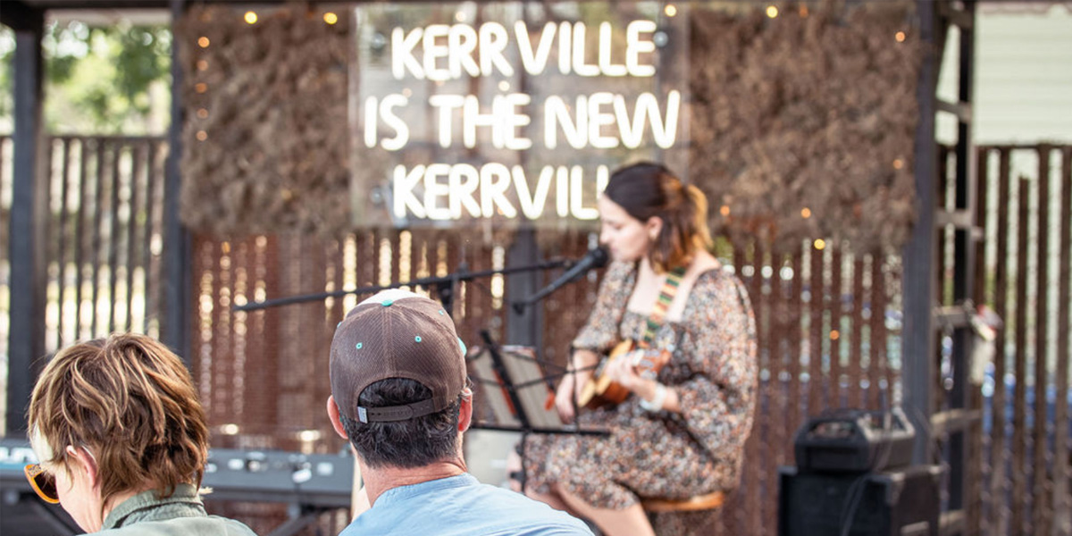 Guitarist on stage playing for a crowd