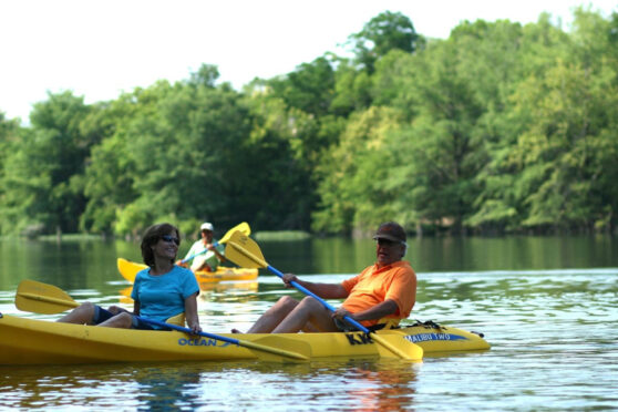 Man and woman in kayak on river