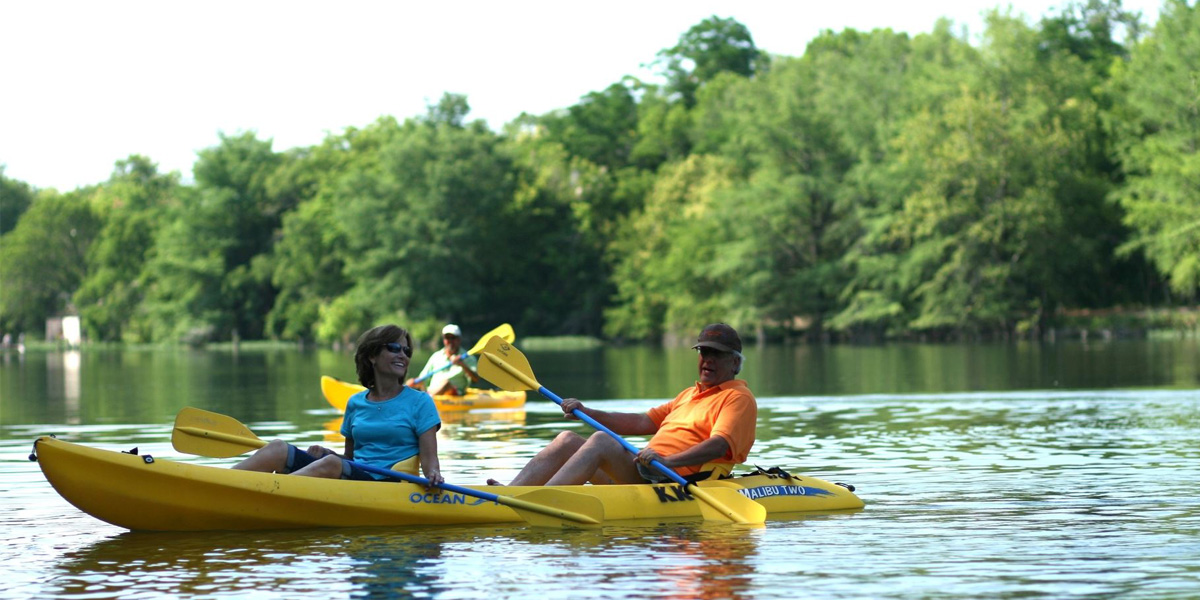 Man and woman in kayak on river