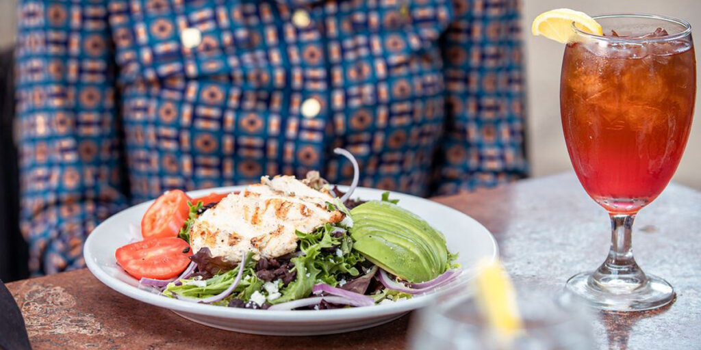 Chicken salad dinner entre with glass of tea