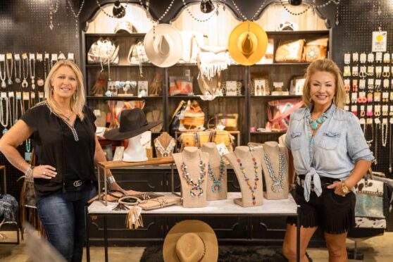 Two women standing in front of the Lady Cave at Blue Oak Trading Company