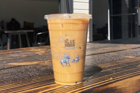Iced coffee from Blue Roan sitting on a wooden table
