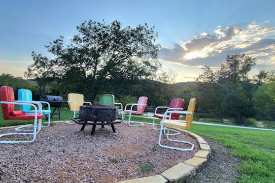 Chairs at firepit at sunset