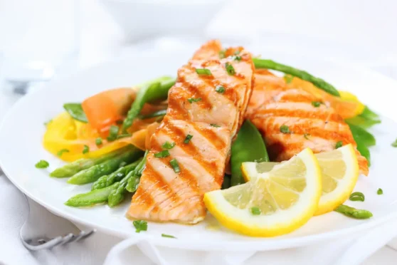 salmon dish with greens and lemon