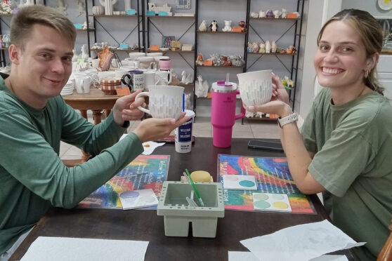 Color of Clay couple painting pottery