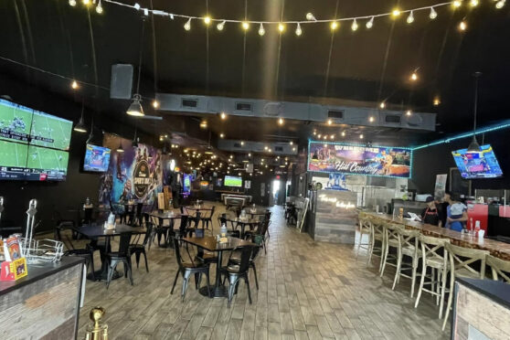 Divines Sports Bar Dining Area with TVs chairs and tables