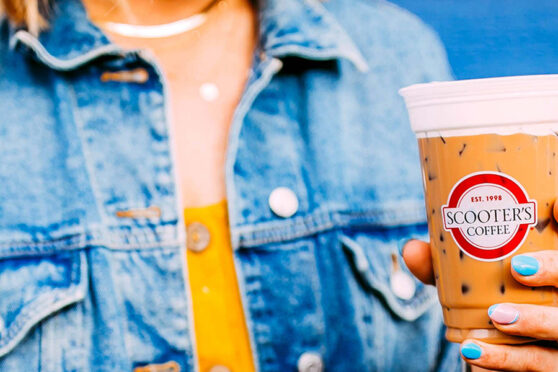Girl holding Scooter's Coffee Cup