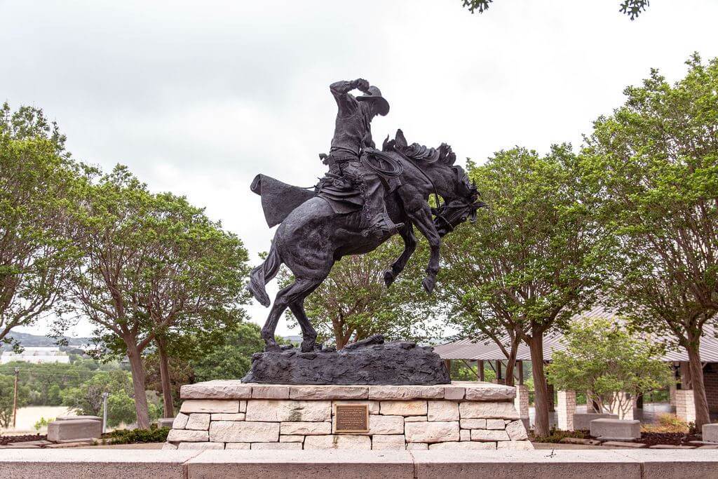 Bronze statue of cowboy on a horse at the Western Art Museum