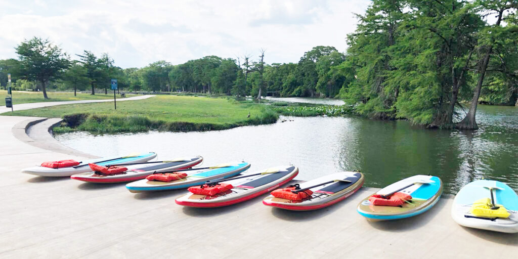 Paddle boards near river