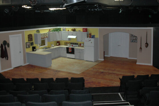 Playhouse 2000 Stage with a vignette of a home