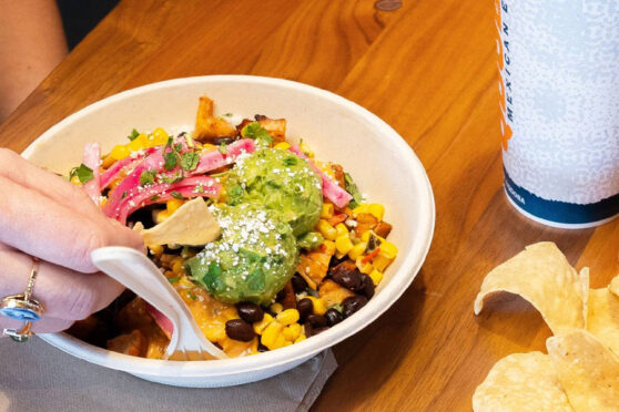 QDoba Bowl meal with drinks and chips