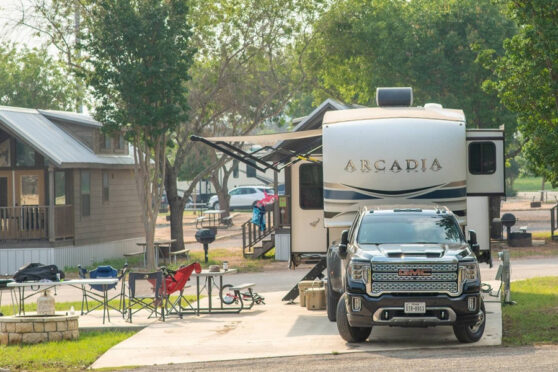 RV Parked in front of cabin at Yogi Bear's Jellystone Park Camp-Resort