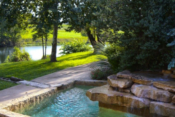 Shonto Ranch Cocktail Pool with green grass and trees surrounding