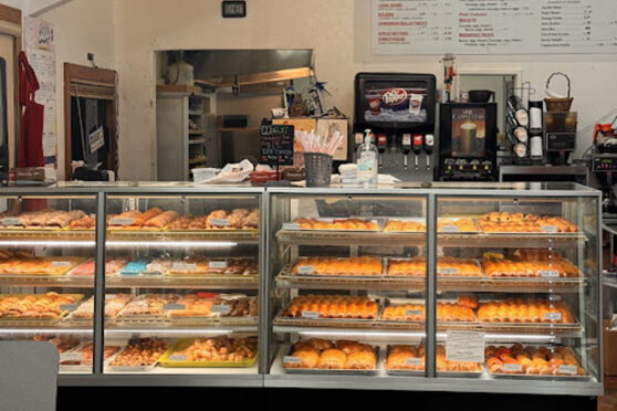 Counter with baked goods at Breads at Snowflake Donut Shop & Kolaches