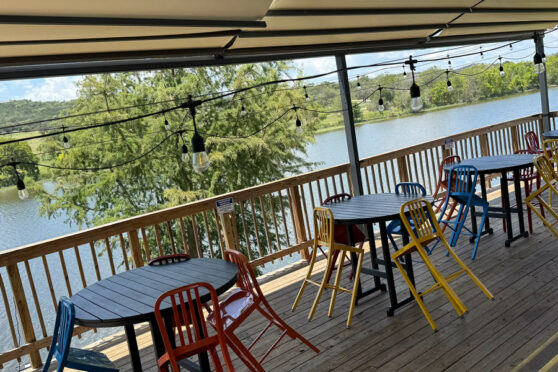 The Boat patio with tables and chairs