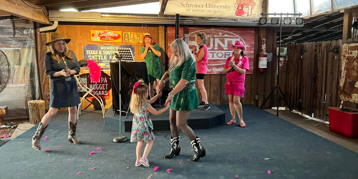 The Hunt Store stage with dancers
