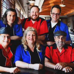The New Buddy Holly Band posing in diner