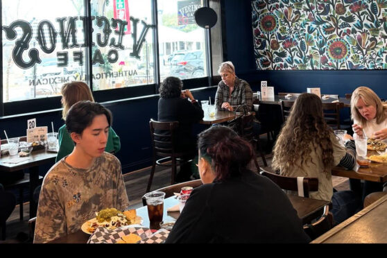 Vecinos Dining area with tables and chairs