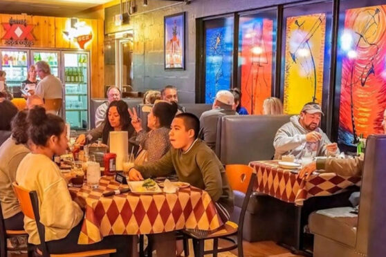 Wahoos Seafood dining area with customers
