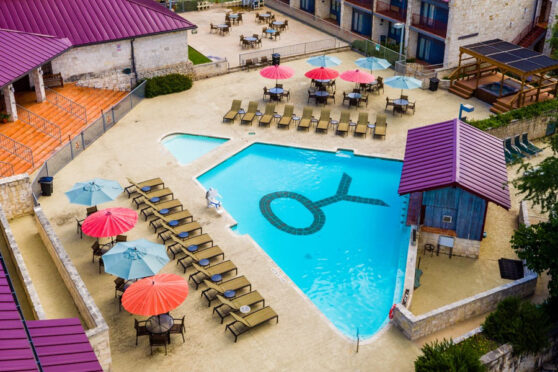 Outdoor pool with chairs on the sides and a Y.O. marking in the middle