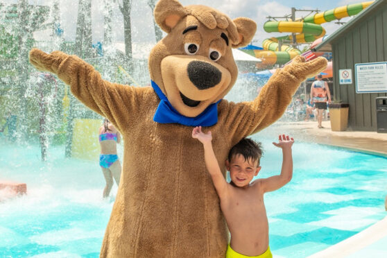 Yogi with child at Yogi Bear's Jellystone Park Camp-Resort