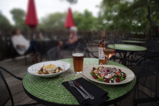 Patio seating with fine-dining food and wine.