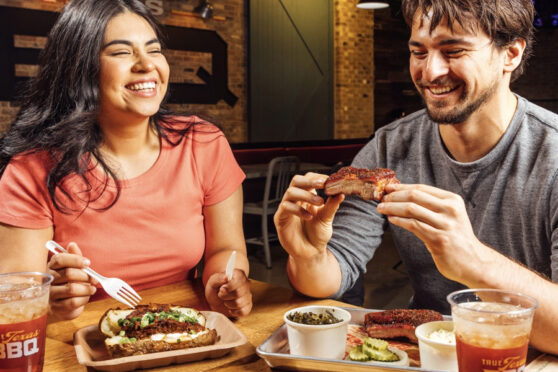 Couple eating BBQ -Photo Credit: True Texas BBQ