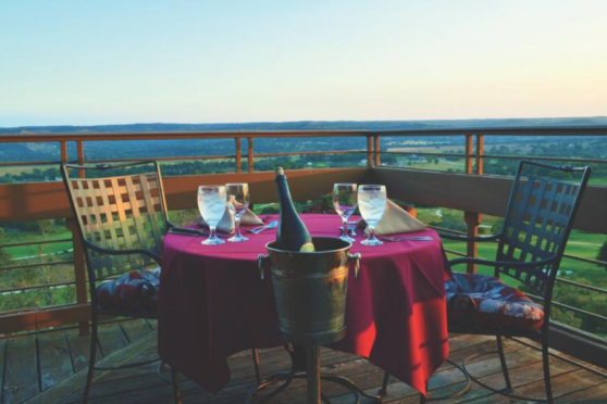 Dining table with champagne overlooking golf course