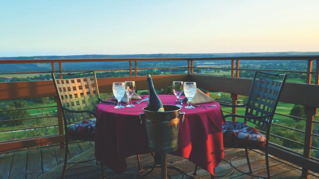 Dining table with champagne overlooking golf course