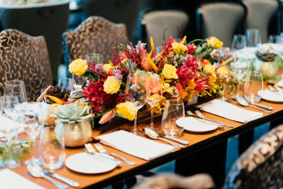 Dining Table set with fresh flowers and cutlery