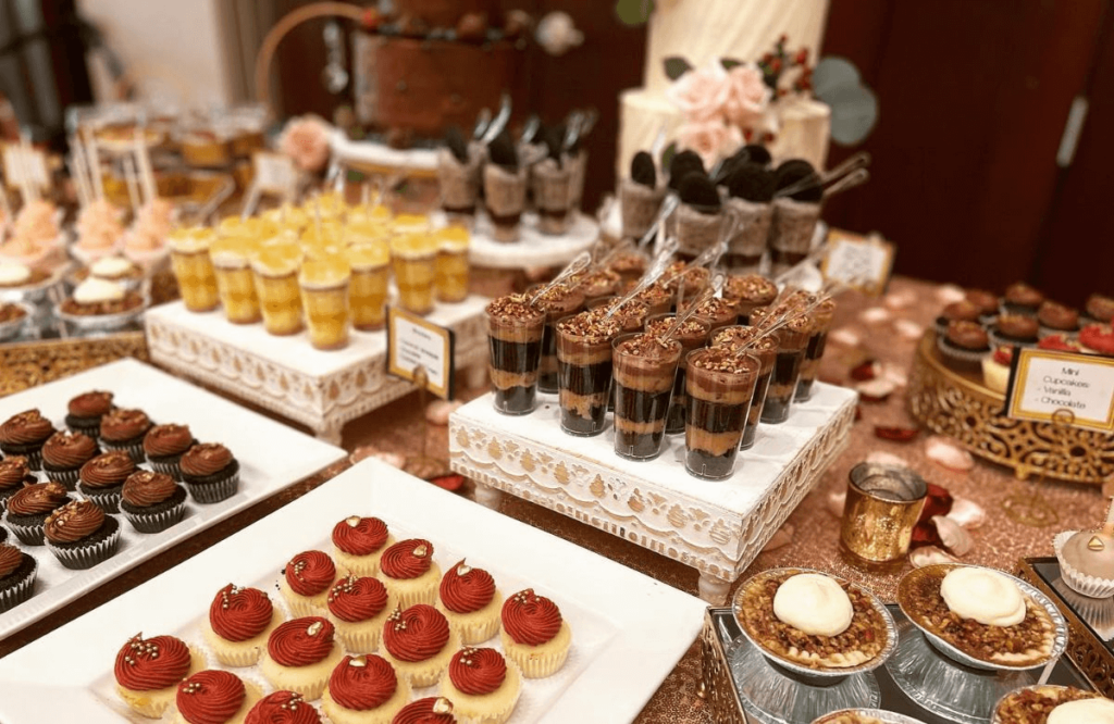 Cupcakes and confections on table