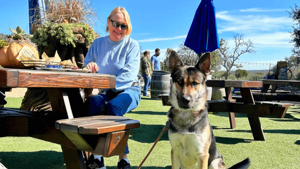 Dog and owner at outdoor patio