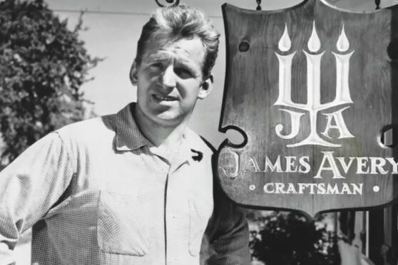 James Avery Headshot next to signage