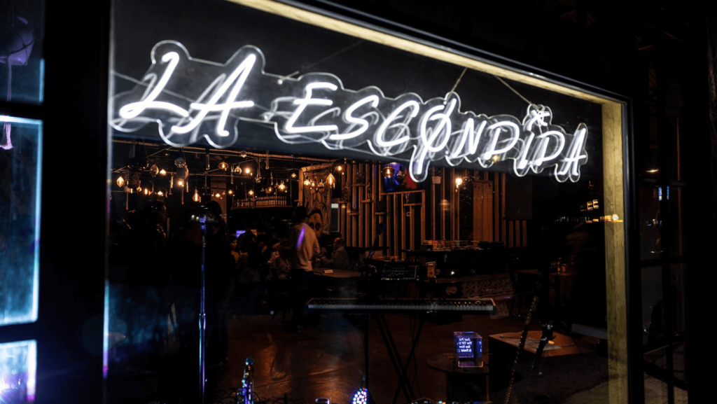 Neon sign spelling La Escondia