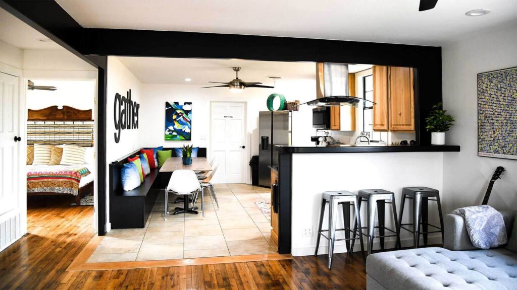 The Starkey House living room kitchen with 'gather' sign on wall