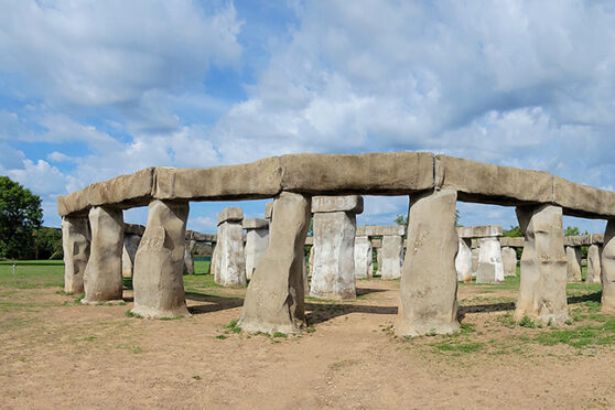 Stonehenge replica of balanced rocks in a field