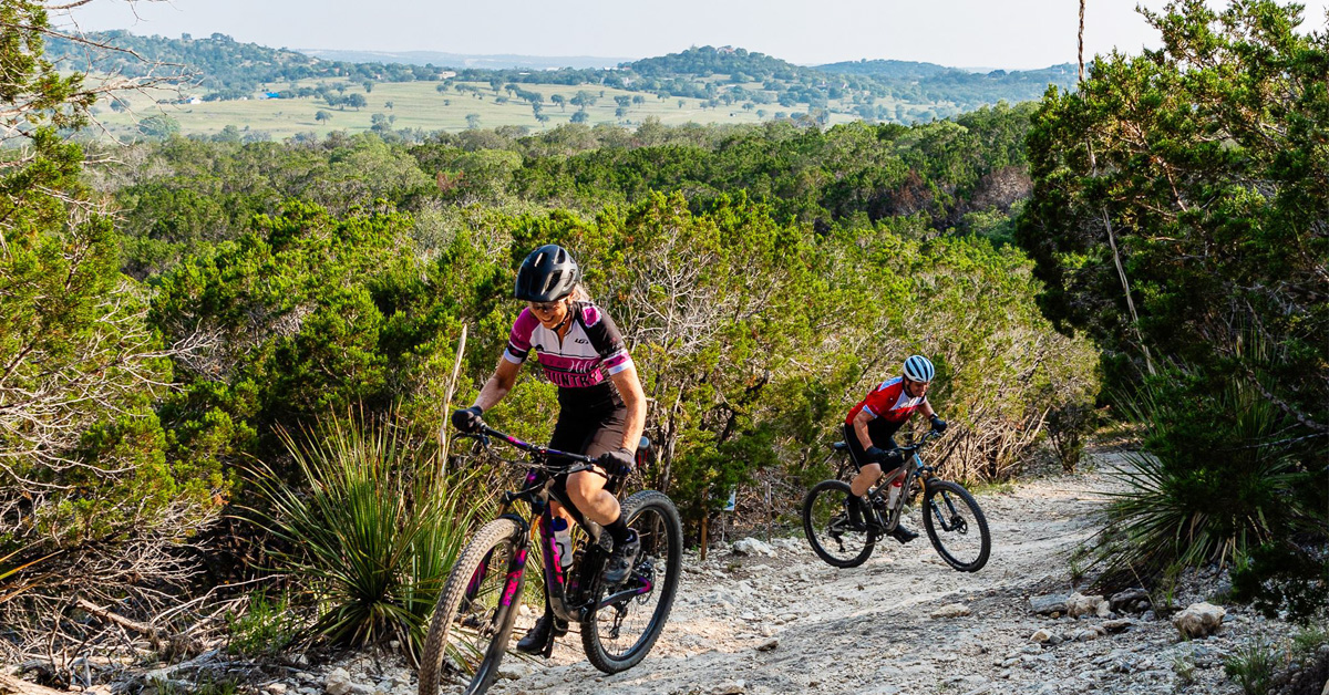 Mountain Bikers riding up a trail