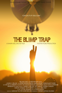 Blimp flying over a person holding a peace sign