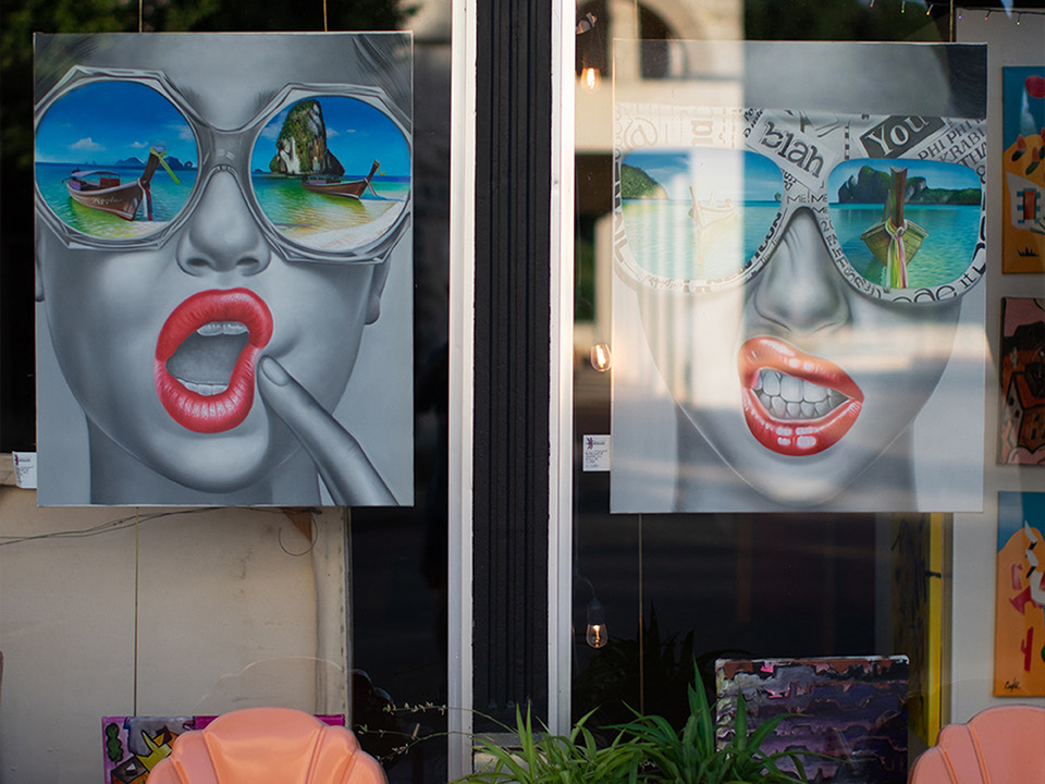 Local art on display in the window of a downtown gallery